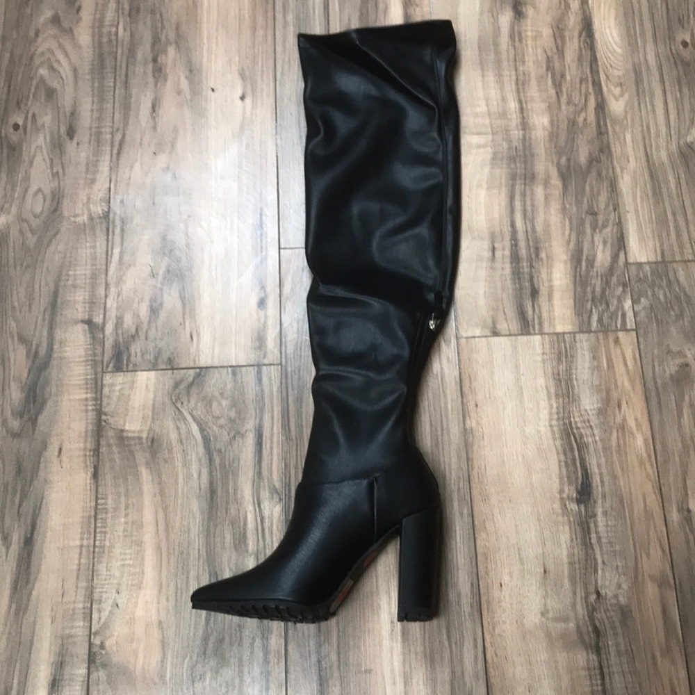 Over the knee high heeled black boots
